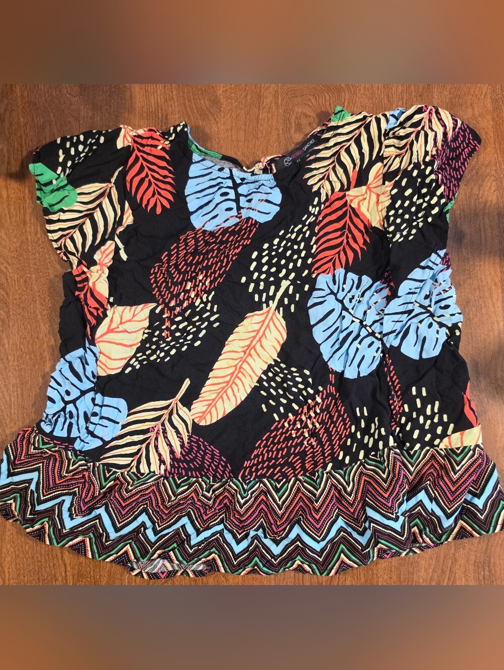 Roselyn Sanchez Tropical Leaf Print Black Blouse with Blue & Coral Leaves